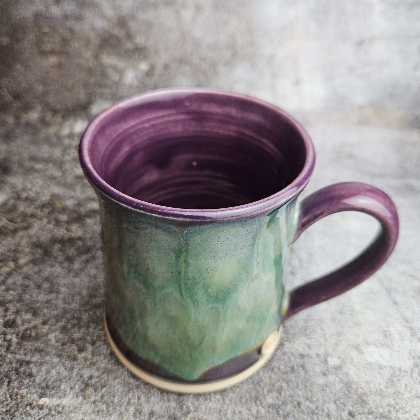 Flowing ice, green over purple mug with ear shape handle
