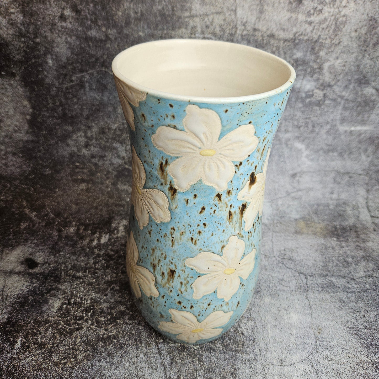 Lilies on baby blue vase