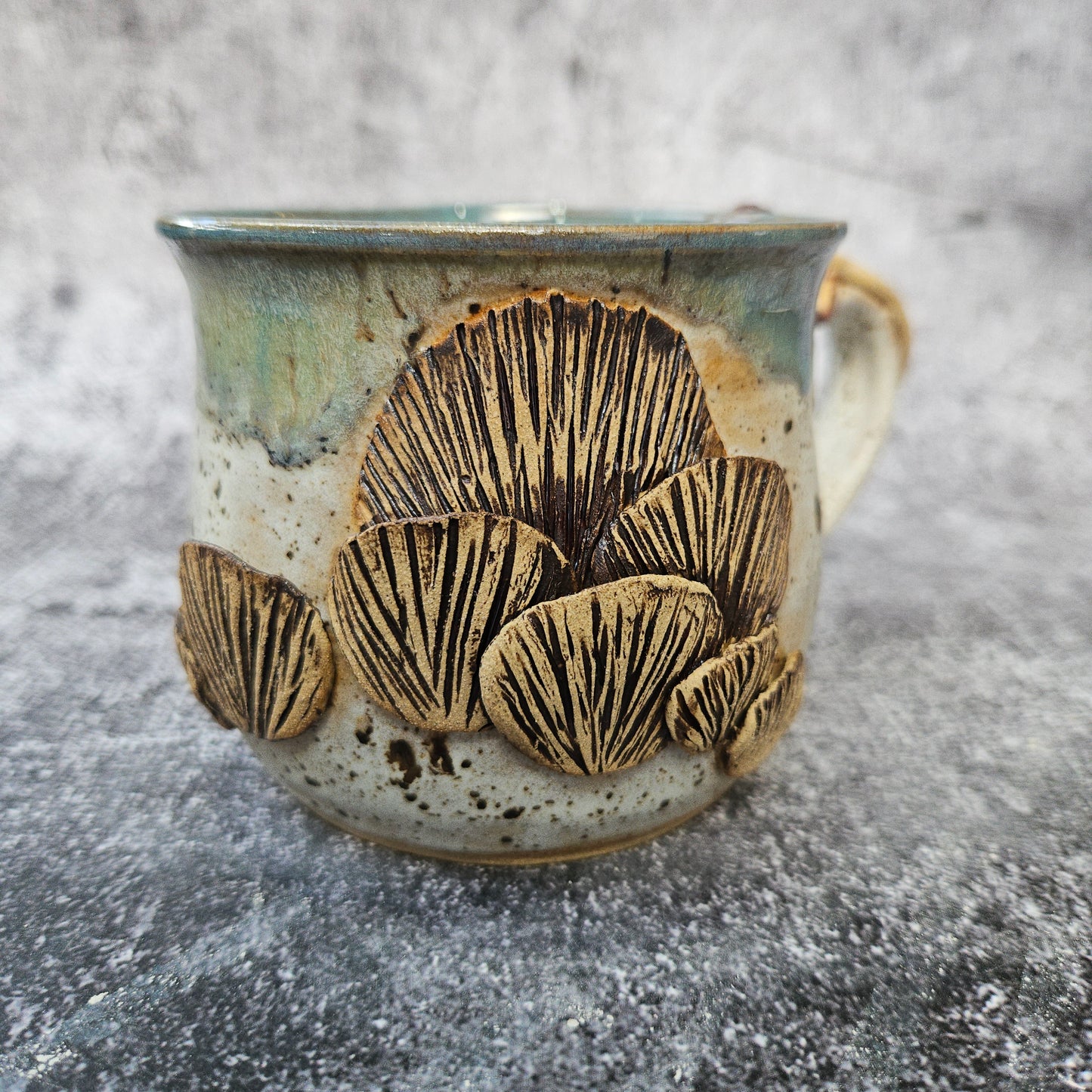 Mushroom adorned cup