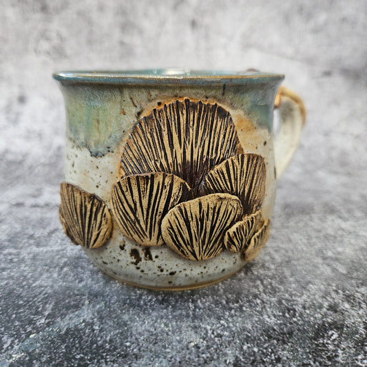 Mushroom adorned cup