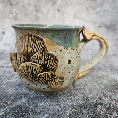 Mushroom adorned cup