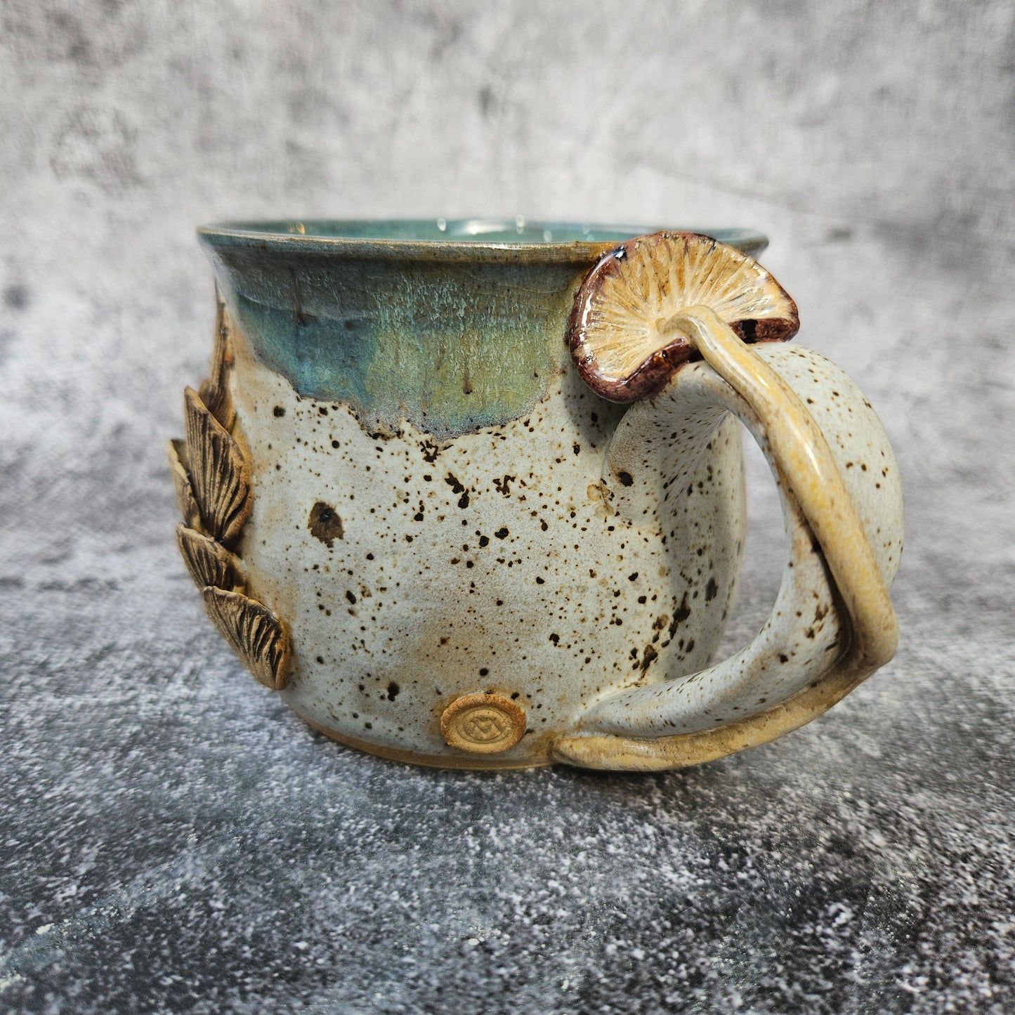 Mushroom adorned cup