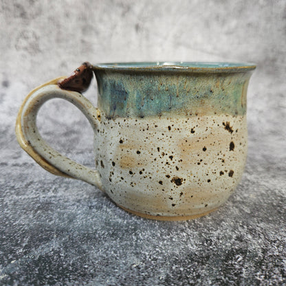 Mushroom adorned cup