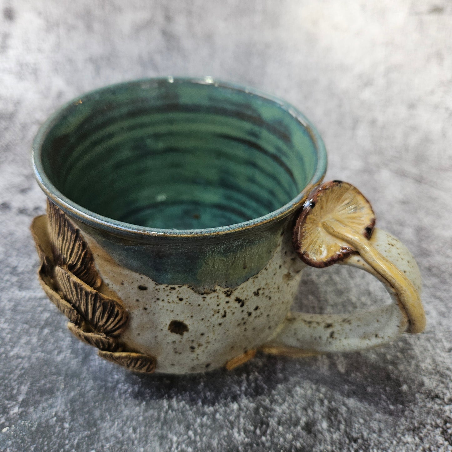 Mushroom adorned cup