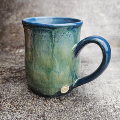Flowing ice, green over blue mug