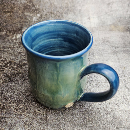 Flowing ice, green over blue mug