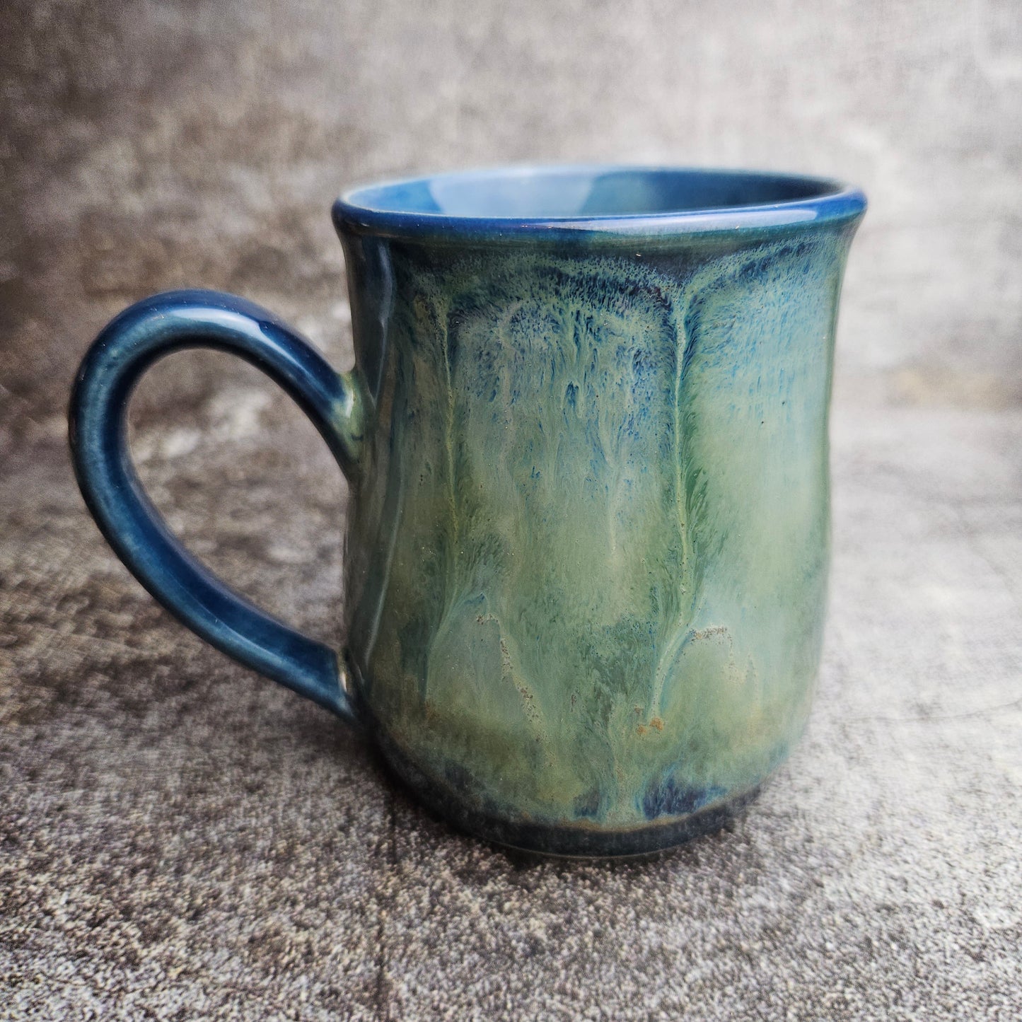 Flowing ice, green over blue mug