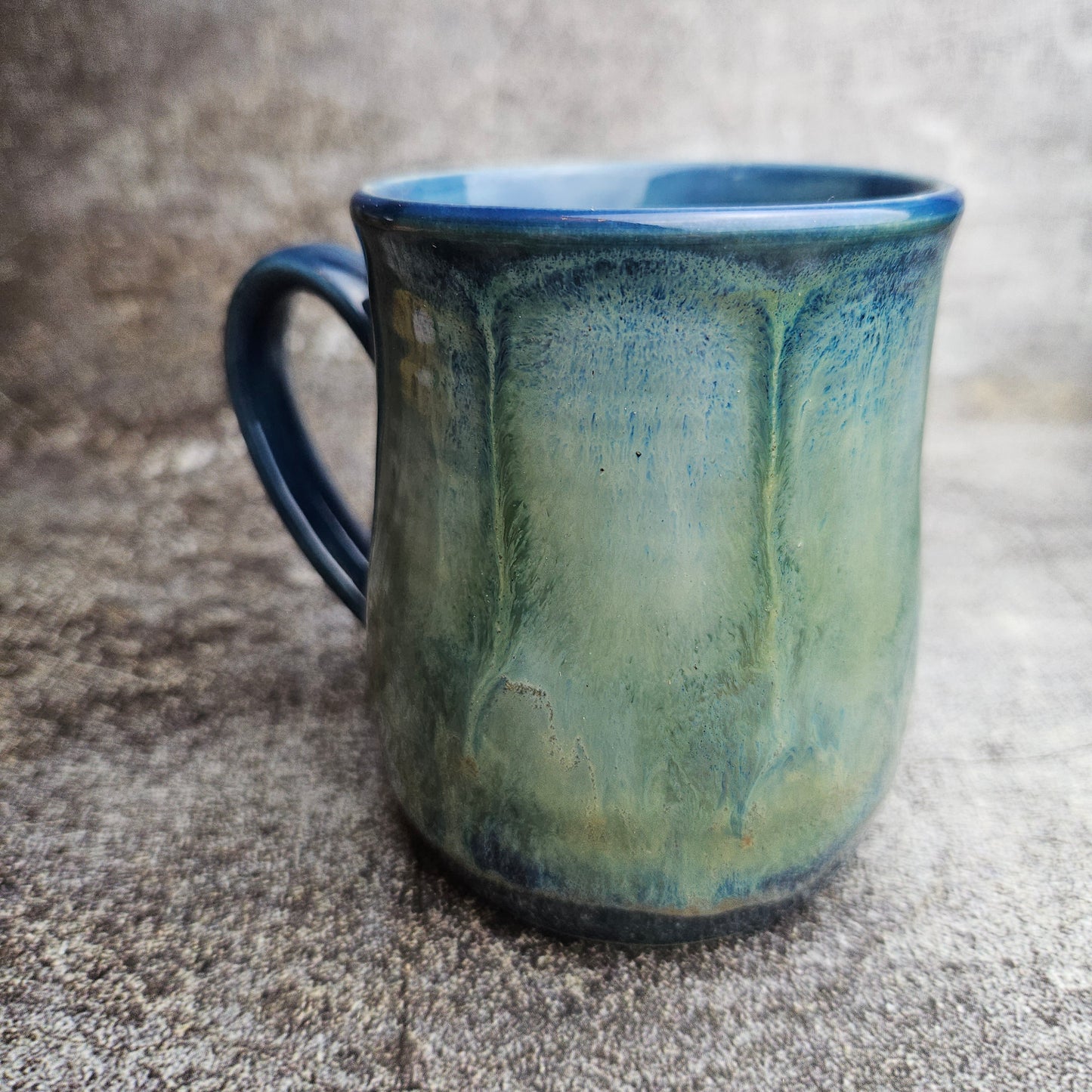 Flowing ice, green over blue mug